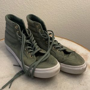 Army green vans with gold accents.